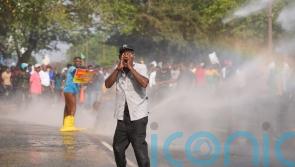 Protesters demonstrating over living costs hit with tear gas and water cannon
