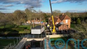 Crane lifts pool out of spa block at home of Captain Tom’s family