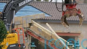 Digger tears down building in demolition at home of Captain Tom’s family