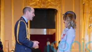William back at work for investiture ceremony as King fights cancer