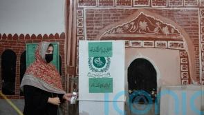 Nawaz Sharif strikes confident note in Pakistan vote marred by Khan imprisonment