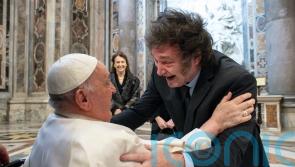 Pope and president embrace as Francis canonises Argentina’s first female saint