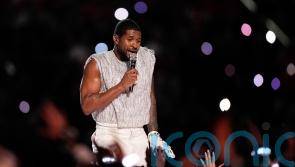 Usher performs medley of hits at Super Bowl half-time show beside special guests