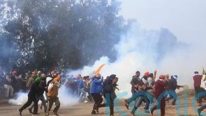 Police use tear gas on Indian farmers at New Delhi protest over crop prices