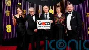 Veteran filmmaker Ken Loach poses at Baftas with sign calling for Gaza ceasefire