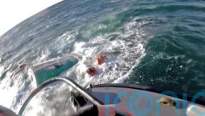 Four people rescued after fishing boat sinks
