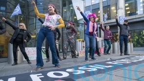 Climate activists stage ‘Stayin’ Alive’ dance demo outside pensions conference