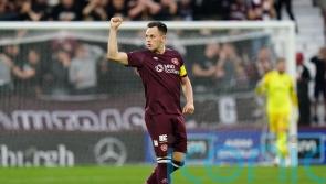 Lawrence Shankland scores from the spot as Hearts hit back to draw with Hibs