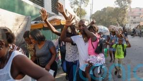 Gunfire paralyses Haiti’s capital as gang leader threatens police chief