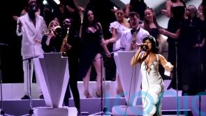 Raye makes Brit Awards history with six gongs