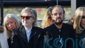 Paul McCartney and Ringo Starr sit front row at Stella McCartney fashion show