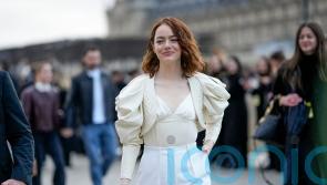 Oscar nominee Emma Stone leads parade of A-listers at Louis Vuitton show
