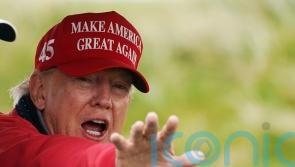 Donald Trump to pay legal fees of company sued over dossier allegations