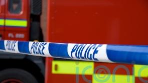 Dozens of firefighters tackle shop blaze
