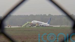Passengers evacuated as United Airlines plane rolls off the runway in Texas