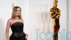 Margot Robbie wears surprise colour on star-studded Oscars red carpet