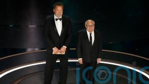 Twins stars and Batman villains Schwarzenegger and DeVito reunite at Oscars