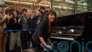 Norah Jones delights passers-by at St Pancras with piano performance