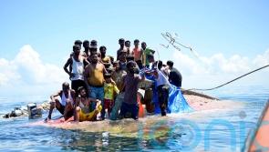 Dozens of refugees rescued in Indonesia after night on hull of capsized boat