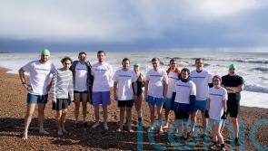 Journalists swim in solidarity one year since US reporter imprisoned in Russia