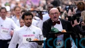 The waiting game! Cafe workers carry loaded trays in 2km race through Paris