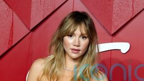 Suki Waterhouse reveals gender of new baby during Coachella set