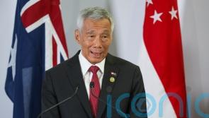 Singapore’s prime minister will step down on May 15
