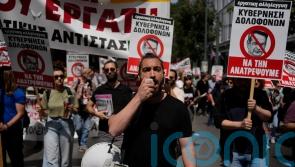 Unions in Greece call widespread strikes, seeking return of bargaining rights