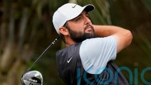 Scottie Scheffler five strokes ahead with weather forcing a Monday finish
