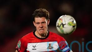 Ten-man Doncaster secure League Two play-off spot with draw at Gillingham
