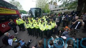 Protesters block coach in bid to stop migrants being moved to Bibby Stockholm