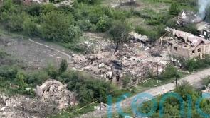Drone footage shows damage in Ukraine village as residents flee Russian advance
