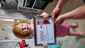 Two-year-old honoured for quick-thinking after neighbours saved from fire