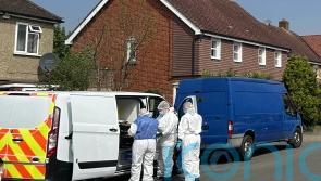 Man held after police officer shot with crossbow following reports of stabbing