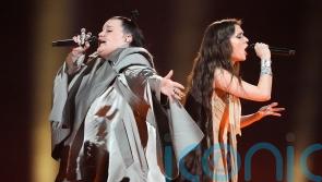 Eurovision acts perform as protesters shout at fans coming into arena