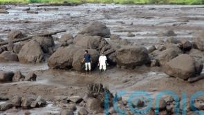 Flash floods caused by heavy rain and cold lava flow kill 37 in Indonesia