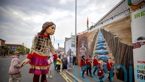 Little Amal meets schoolchildren from both sides of Belfast peace wall