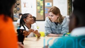 Princess Beatrice praises her mother on school visit to read prize-winning book
