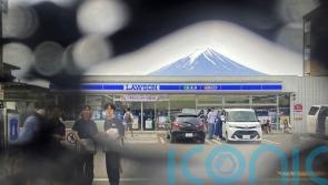 Town finds holes in screen built to prevent tourists taking photos of Mount Fuji