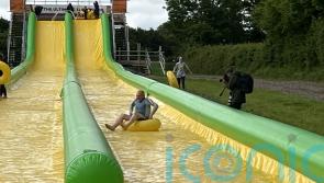 Sir Ed Davey defends election stunts as he races down water slide in rubber ring