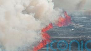 Lava continues to flow from Iceland volcano but activity calms significantly
