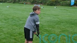 Boy with limb difference ‘excited’ to play golf with grandfather thanks to tool