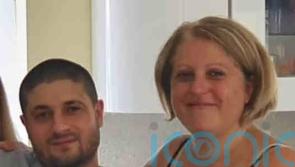 Man, 63, appears in court charged with murders of his wife and her son