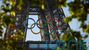 Paris organisers unveil five Olympic rings mounted on Eiffel Tower