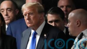 Judge strikes wording from Trump documents case but will not dismiss charges
