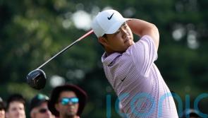 Tom Kim keeps lead as Shane Lowry and Robert MacIntyre shoot into contention