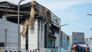 South Korean investigators search factory ruins after fire kills 23