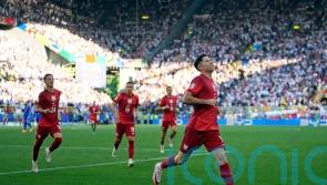 Robert Lewandowski penalty earns Poland a point as France miss out on top spot