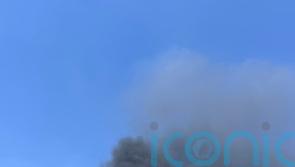 Large fire breaks out at tower block in Surrey town centre