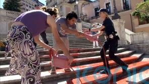 Activists pour paint down Rome’s Spanish Steps in outrage over femicide in Italy